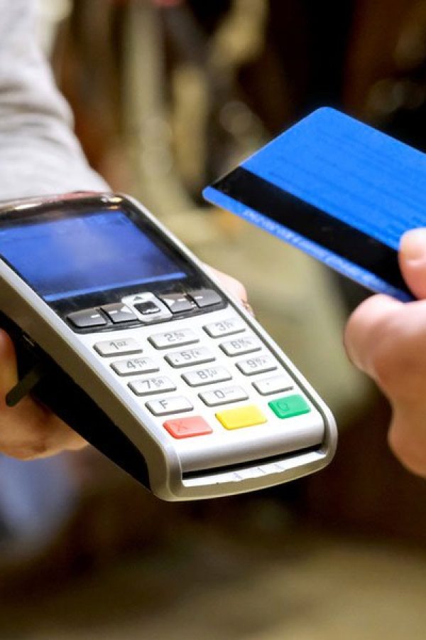 A person pays in a shop with their credit card.